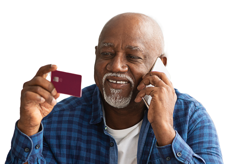 senior-african-man-using-credit-card-talking-on-ph-2021-12-09-21-51-41-utc copy 1